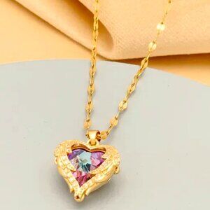 MED SIZE PURPLE MULTIFACETED HEART ENCLOSED IN A GOLD RETRO STYLE CASE NECKLACE